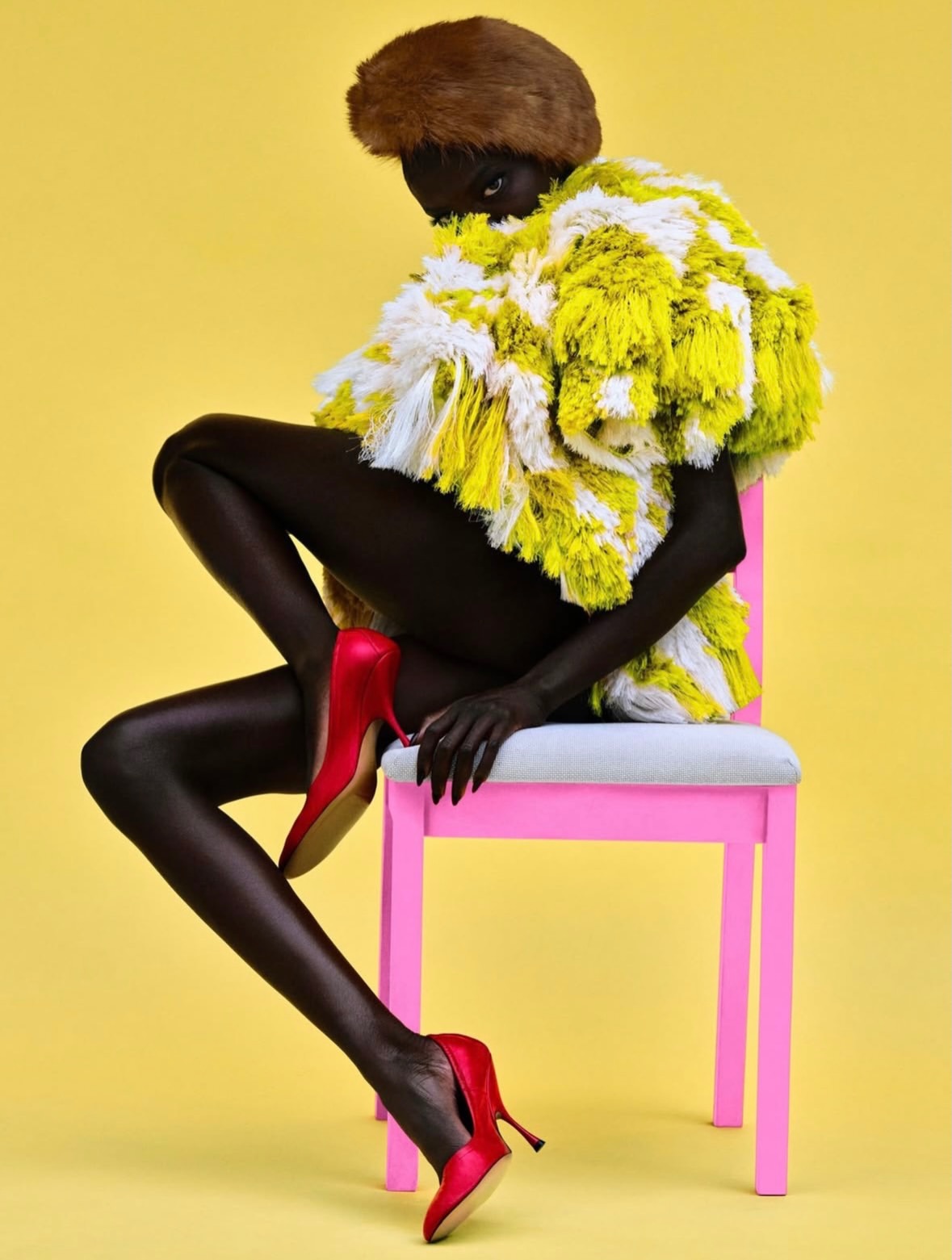 Anok Yai moves through each frame like a vision of...