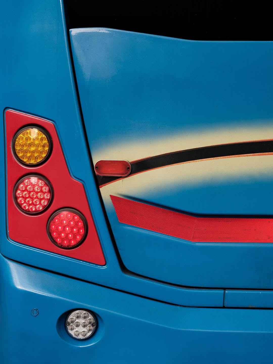 Bondi by @josederocco 

“In the vibrant fabric of Buenos Aires, where the city’s pulse never stops, short-distance buses rise as symbols of urban dynamism. This series explores a lesser-known yet equally fascinating facet of these public transport icons: the graphic design that adorns them as a foundation. 

– Instead of the advertisements and messages that typically saturate these surfaces, the viewer encounters compositions reminiscent of geometric abstract art, evoking a sense of order and harmony amid urban chaos.

Bondi, by removing the visual noise of signage, it urges us to look beyond the functional and appreciate the inherent aesthetics in the most mundane details of our everyday surroundings.”