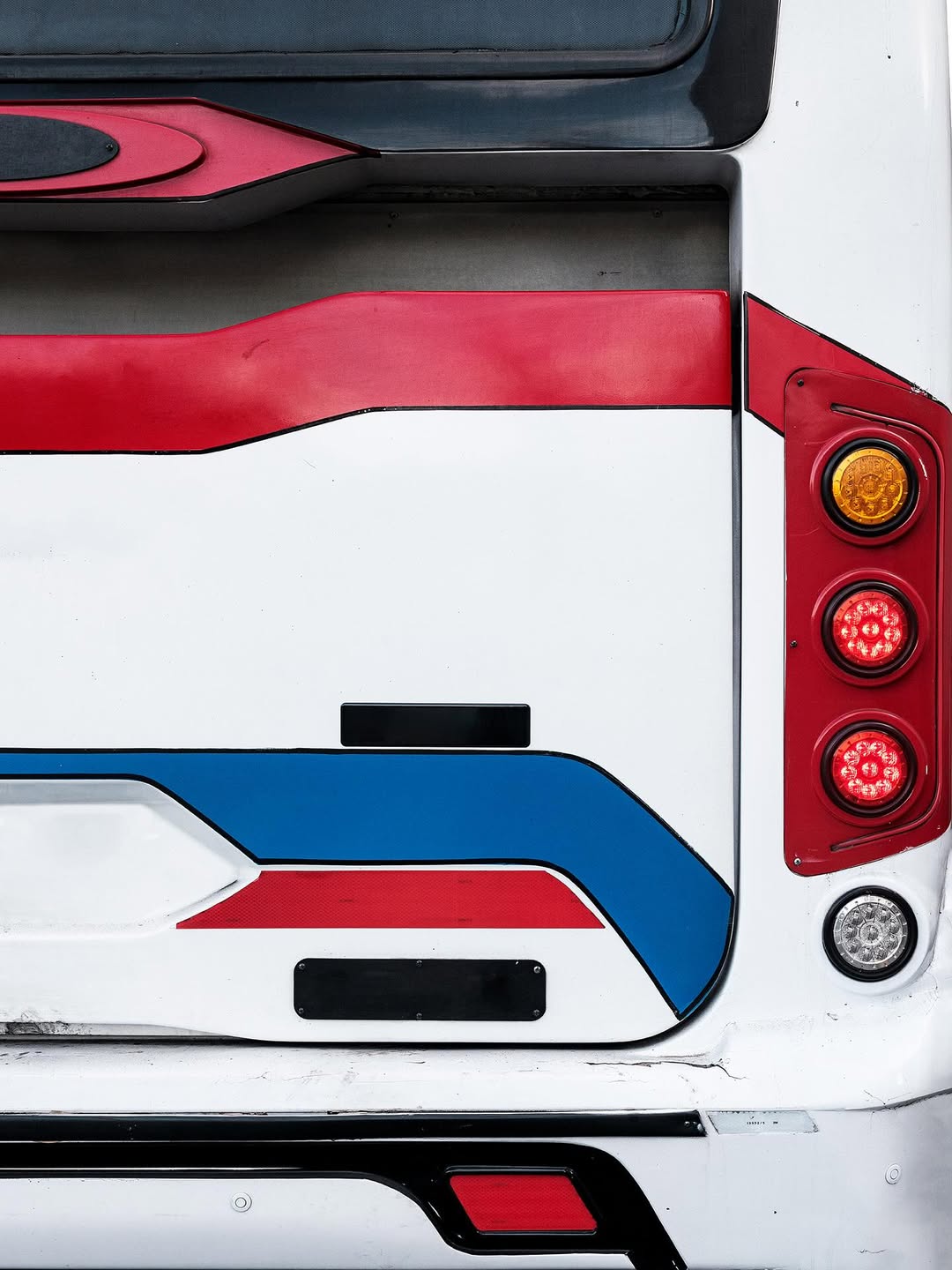 Bondi by @josederocco 

“In the vibrant fabric of Buenos Aires, where the city’s pulse never stops, short-distance buses rise as symbols of urban dynamism. This series explores a lesser-known yet equally fascinating facet of these public transport icons: the graphic design that adorns them as a foundation. 

– Instead of the advertisements and messages that typically saturate these surfaces, the viewer encounters compositions reminiscent of geometric abstract art, evoking a sense of order and harmony amid urban chaos.

Bondi, by removing the visual noise of signage, it urges us to look beyond the functional and appreciate the inherent aesthetics in the most mundane details of our everyday surroundings.”
