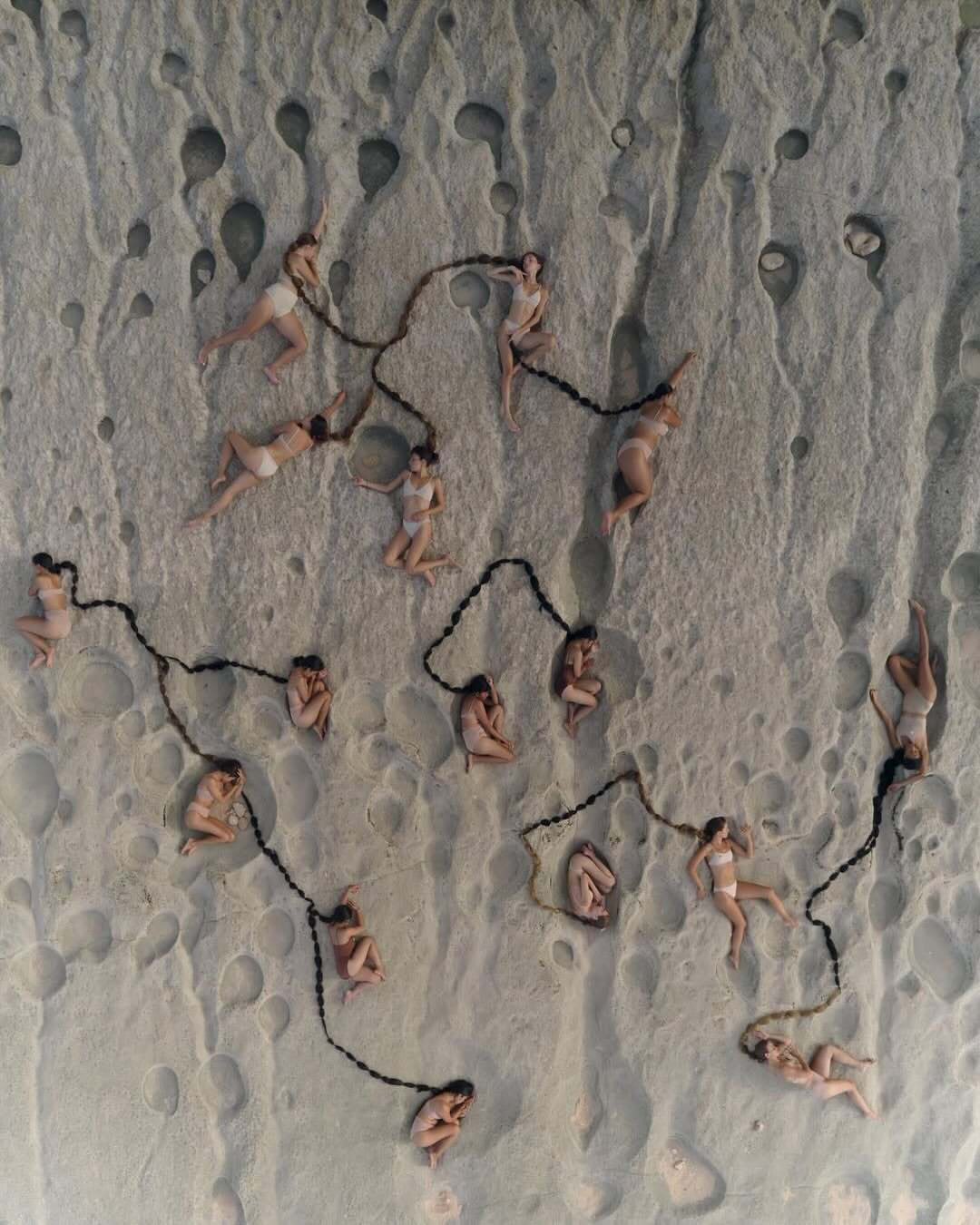 ‘Rivers of Hair’ by @nataliekarpushenko

“Women of all ages, sizes and cultures,
cradled by the reef,
their hair unraveling into ocean roots.
The sea calls, the earth listens,
as time drifts backward in quiet waves.”

In collaboration with @carinahardy.studio 
Produced by @cccaaarrrhhh
Drone assistent @romaodintsow