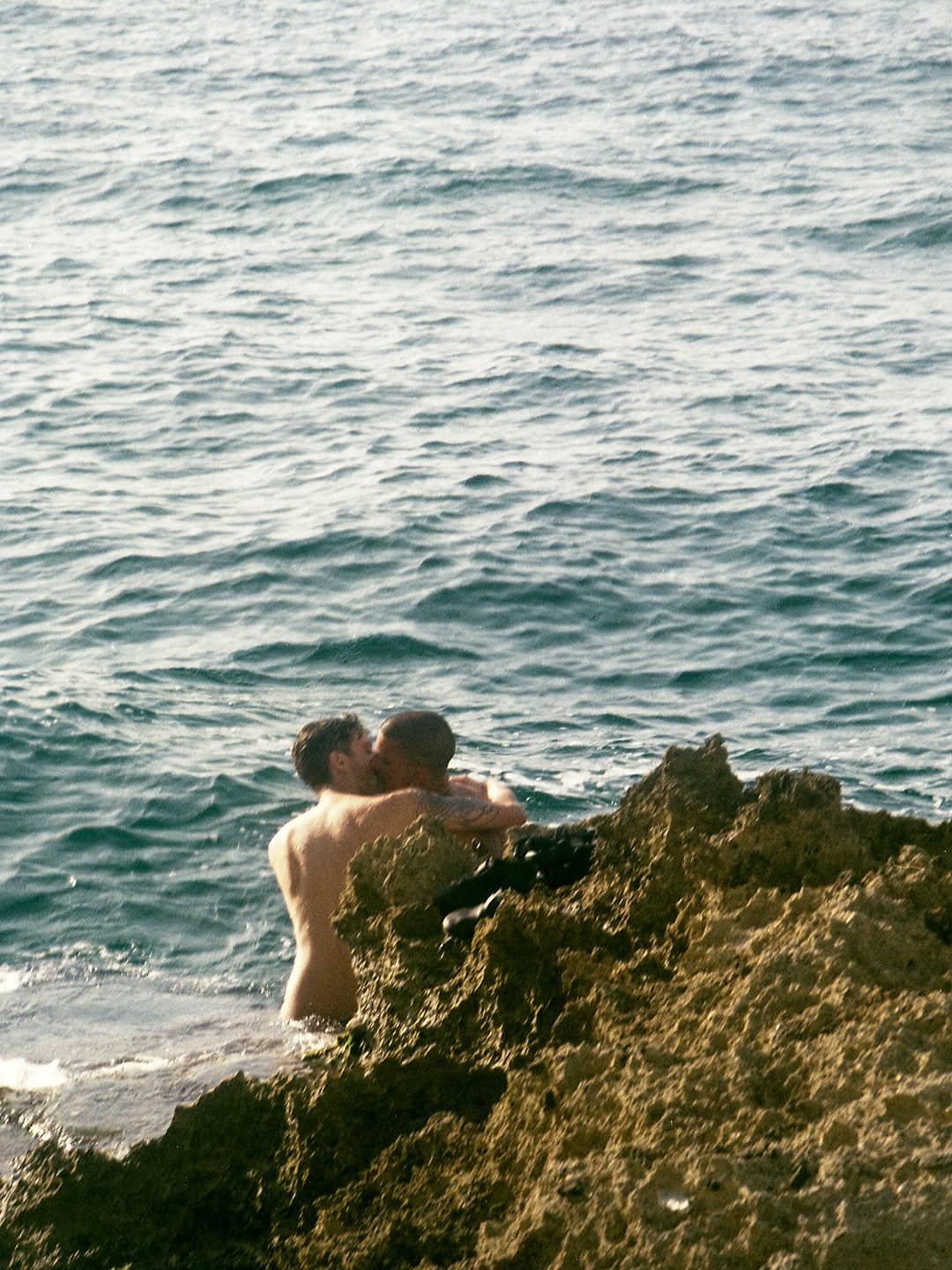Selections from photographer and filmmaker Dani d’Ingeo’s (@remainsofd) debut photography book, ‘New Order.’

Arriving in London in 2016 for education, they found passion in documenting LGBTQIA+ communities around them. Mainly using 35mm compact film cameras, Dani captures the rich fabric of the queer experience from an insider point of view, the overlapping of simple mundanity, tender intimacy and nightlife.

"With this project I embarked on a symbolic trip back to the motherland I felt rejected by as a child, in order to establish a new, renovated connection with my roots by depicting queer bodies and individuals flourishing in that environment. The archived holiday imagery, all shot against the idyllic Southern Italian coast, was an attempt to honour existence outside of metropolitan settings and to expand the framework of the queer visual legacy. I believe that plural, uplifting representation offers social and political change and can empower marginalised communities. Celebrating self determination and visibility in a varied array of spaces can be a testament for the pursuit of queer happiness in any given geographical scenery."

Released and published via SMUT Press in 2022.
