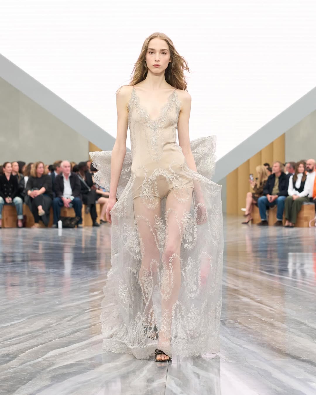 Dior SS26, Paris Fashion Week

During the latest Paris Fashion Week, Jonathan Anderson unveiled his first womenswear collection for Dior. The show opened with an Adam Curtis–directed short film projected on a pyramidal screen, tracing Dior’s creative legacy, from Christian Dior’s floral silhouettes to Galliano’s theatrical flair, while paying homage to Maria Grazia Chiuri’s artistic influence.
Models appeared from behind an open Dior archival box, wearing reimagined classics infused with Anderson’s postmodern, surreal touch. The opening look, a white dress echoing Dior’s 1952 “Cigale” design, set the tone with exaggerated bows and sculptural shapes. Throughout, Anderson intertwined his own aesthetic with the house’s heritage, blending historical drama with contemporary edge: peplum blazers paired with frayed denim, transparent gowns over nude bodysuits, and voluminous caban coats. Stephen Jones’s origami hats and rose-toe shoes completed a collection that elegantly bridged Dior’s past and Anderson’s avant-garde vision.

Creative Direction @dior @jonathan.anderson
Styling @benjaminbruno_
Make Up @peterphilipsmakeup
Hair @guidopalau
Backstage Photographer @mireia_deulofeu
Post House @sheriff.projects
#sheriffprojects