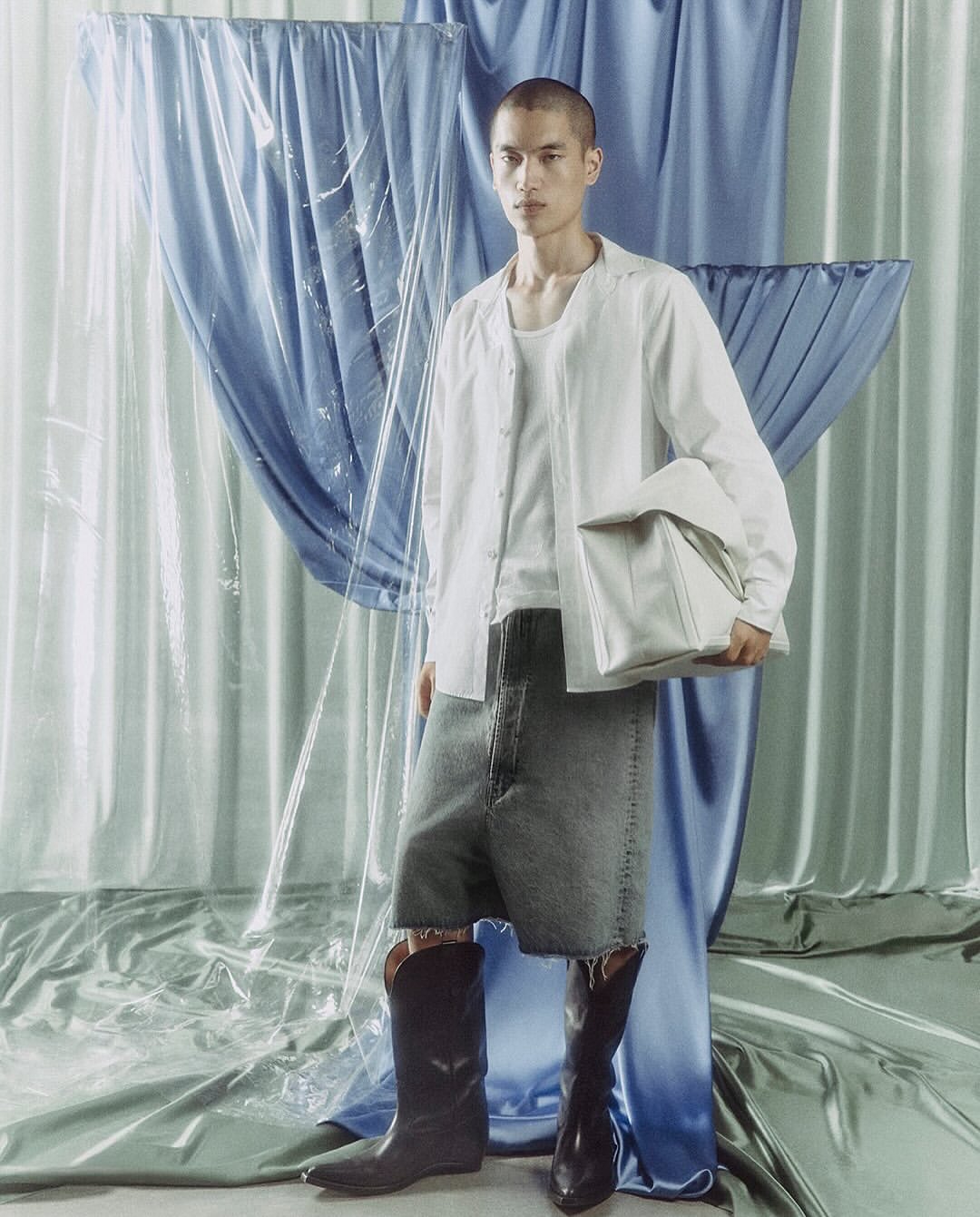 Maison Margiela Co-Ed Spring Summer 2026

Maison Margiela unveils its Co-Ed Spring Summer 2026 campaign, photographed by Mélanie + Ramon.
Rooted in the House archive, the collection explores a straight, structured silhouette shaped through reinterpretation and evolution. Tailoring is reworked with rounded sharp shoulders and deconstructed tuxedo elements inspired by the Maison’s atelier codes. Slip dresses become layered compositions, while floral motifs appear distressed, peeled, and transformed across knitwear and garments. Footwear revisits archival forms through heel-less pumps, transparent Plexi heels, and reimagined Tabi Claws. Accessories introduce the new Box Bag, finished with metallic edging. A collection balancing archival memory with contemporary construction and everyday wearability.

Creative Direction @maisonmargiela @glennmartens
Photographer @melanie_ramon
Talent @isa.brands @margaretgambles @aleksandraleksandrovichgordeev
Styling @iorio_jessica
Hair & Make Up @melanie_schoene
Post House @sheriff.projects
#sheriffprojects