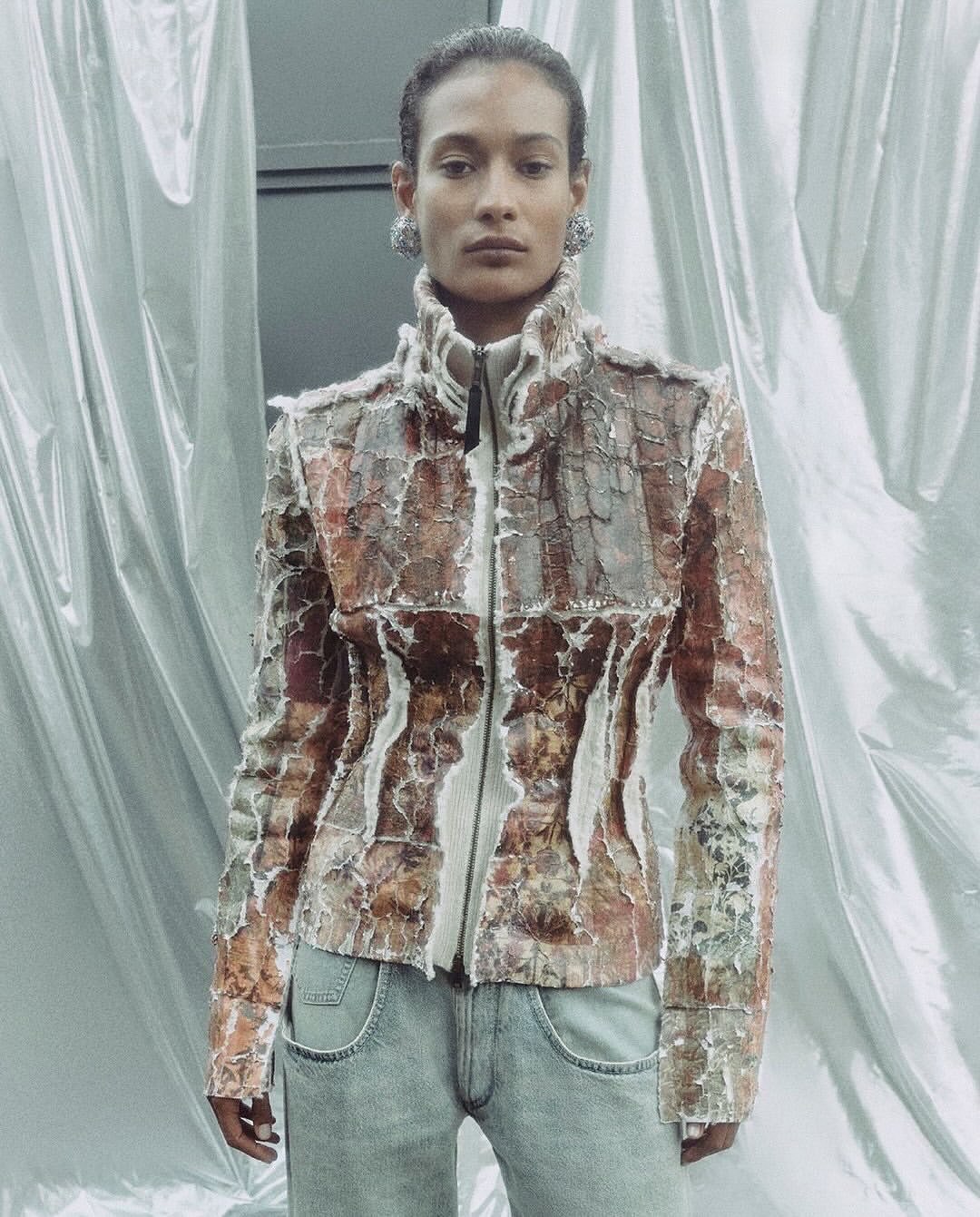 Maison Margiela Co-Ed Spring Summer 2026

Maison Margiela unveils its Co-Ed Spring Summer 2026 campaign, photographed by Mélanie + Ramon.
Rooted in the House archive, the collection explores a straight, structured silhouette shaped through reinterpretation and evolution. Tailoring is reworked with rounded sharp shoulders and deconstructed tuxedo elements inspired by the Maison’s atelier codes. Slip dresses become layered compositions, while floral motifs appear distressed, peeled, and transformed across knitwear and garments. Footwear revisits archival forms through heel-less pumps, transparent Plexi heels, and reimagined Tabi Claws. Accessories introduce the new Box Bag, finished with metallic edging. A collection balancing archival memory with contemporary construction and everyday wearability.

Creative Direction @maisonmargiela @glennmartens
Photographer @melanie_ramon
Talent @isa.brands @margaretgambles @aleksandraleksandrovichgordeev
Styling @iorio_jessica
Hair & Make Up @melanie_schoene
Post House @sheriff.projects
#sheriffprojects
