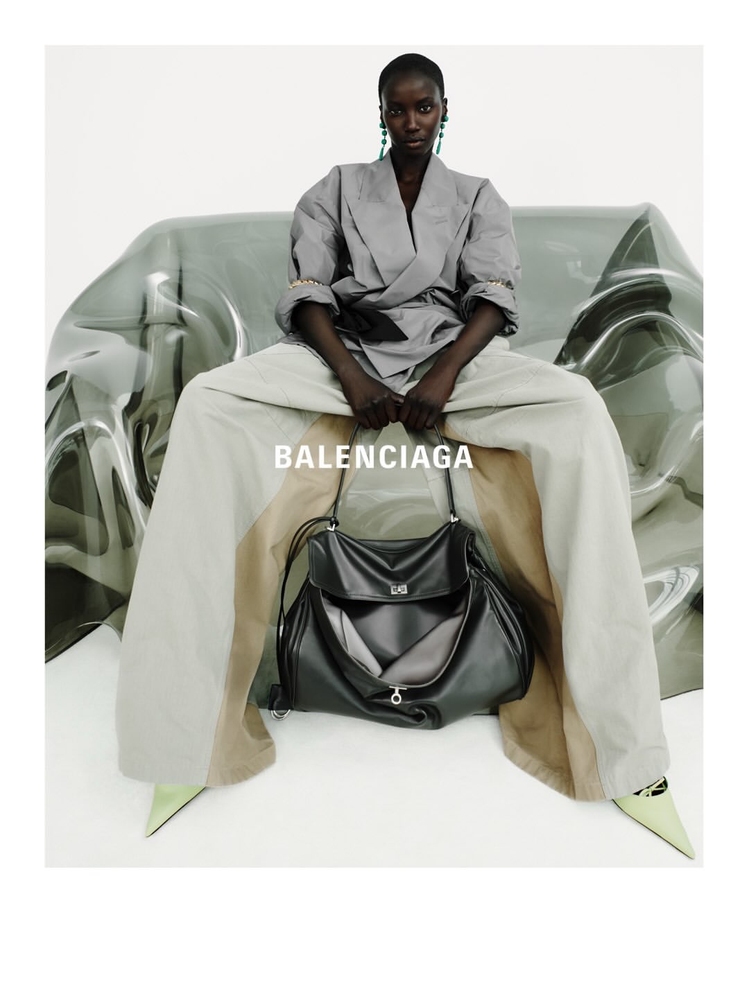 Balenciaga Spring 27 Collection

For Spring 2027, Pierpaolo Piccioli reimagines Balenciaga’s couture legacy through a study of freedom, movement and form.
Built around the concept of the “unsized”, the collection places the body at the center of creation, with fluid silhouettes shaped by fabric rather than structure. Featherlight materials, softened tailoring and reengineered house signatures blur the boundaries between couture and everyday dressing.
Photographed by Robin Galiegue at the threshold of Balenciaga’s historic Avenue George V headquarters, the lookbook captures a dialogue between heritage and reinvention, structure and ease, reality and imagination.

Creative Direction @balenciaga
Photographer @robingaliegue
Styling @imruh
Make Up @thomasdekluyver
Hair @benjaminmullerhair
Set Design @olivia_aine_
Post House @sheriff.projects
#sheriffprojects